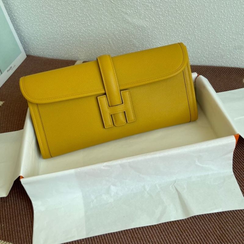 H**mes clutch bags
